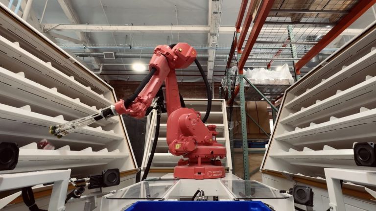 CovariantÕs AI-powered Robotic Putwall system autonomously sorts items at the companyÕs headquarters in Emeryville, Calif., on March 8, 2024. (Balazs Gardi/The New York Times)